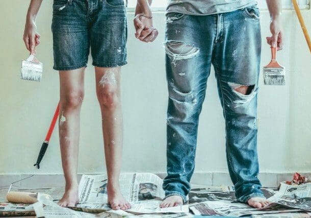 Two paint-covered people